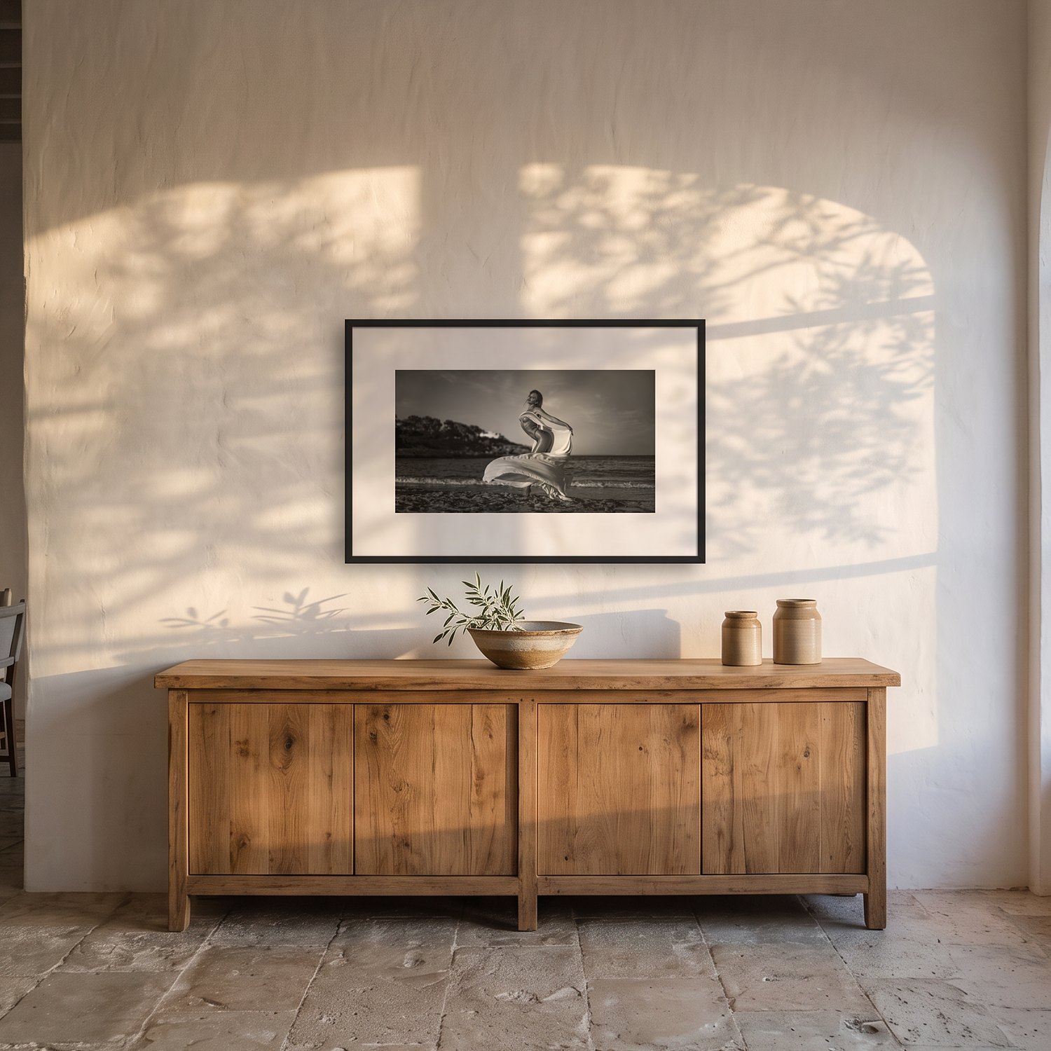 Cala Figuera – Landscape 3 Cala Figuera – black & white fine art print by Marcus Boéll, framed, shown in a dining room