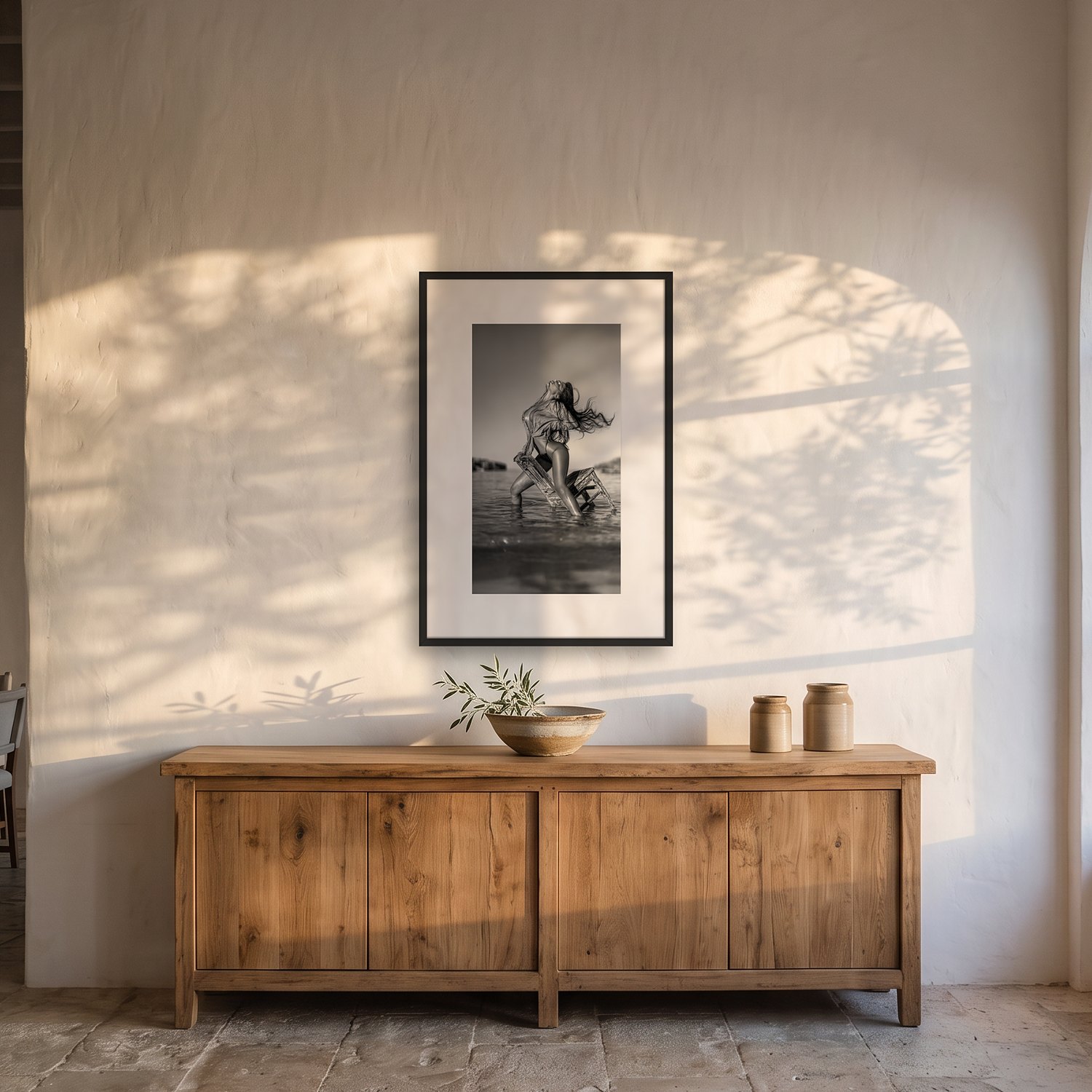 El Palmer 2 El Palmer – black & white fine art print by Marcus Boéll, framed, shown in a dining room