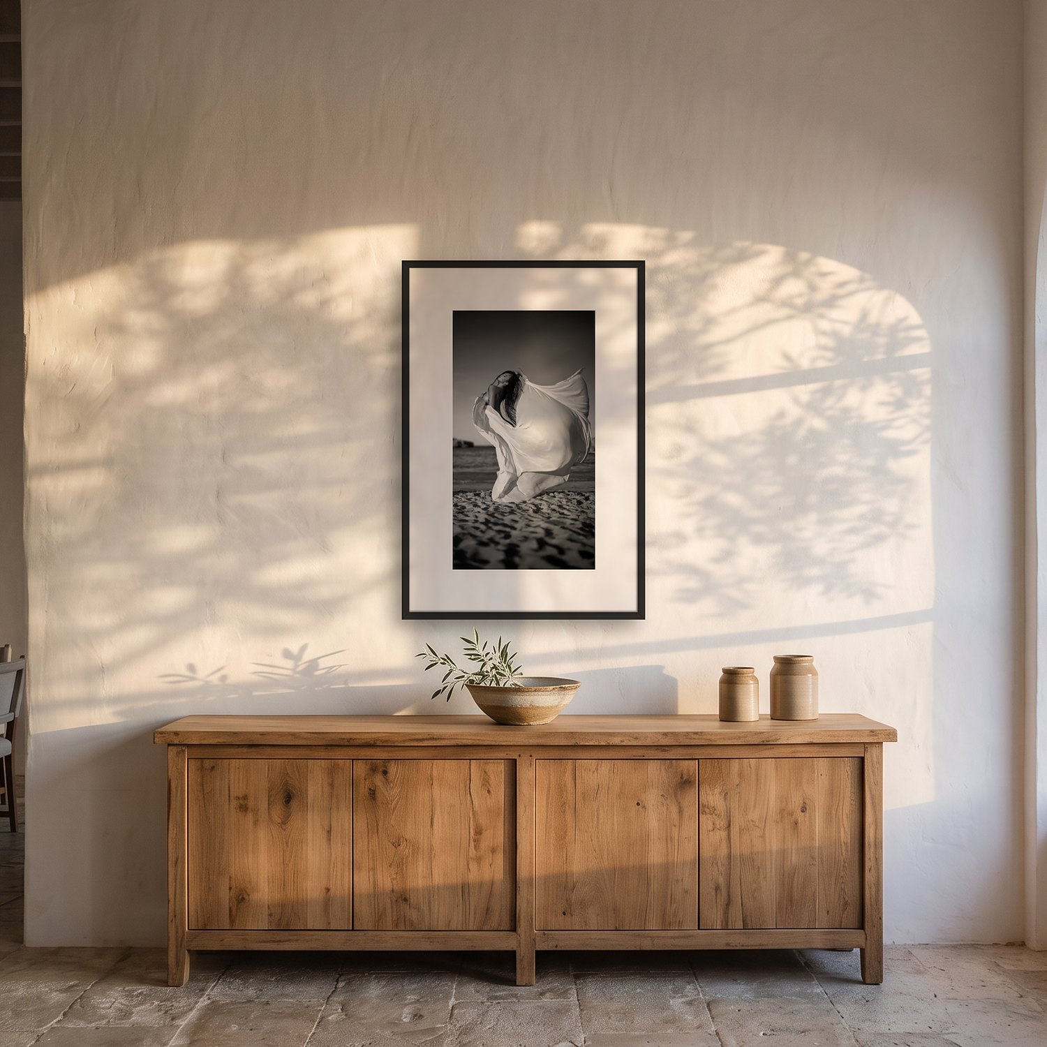 Murada – Portrait 2 Murada – black & white fine art print by Marcus Boéll, framed, shown in a dining room